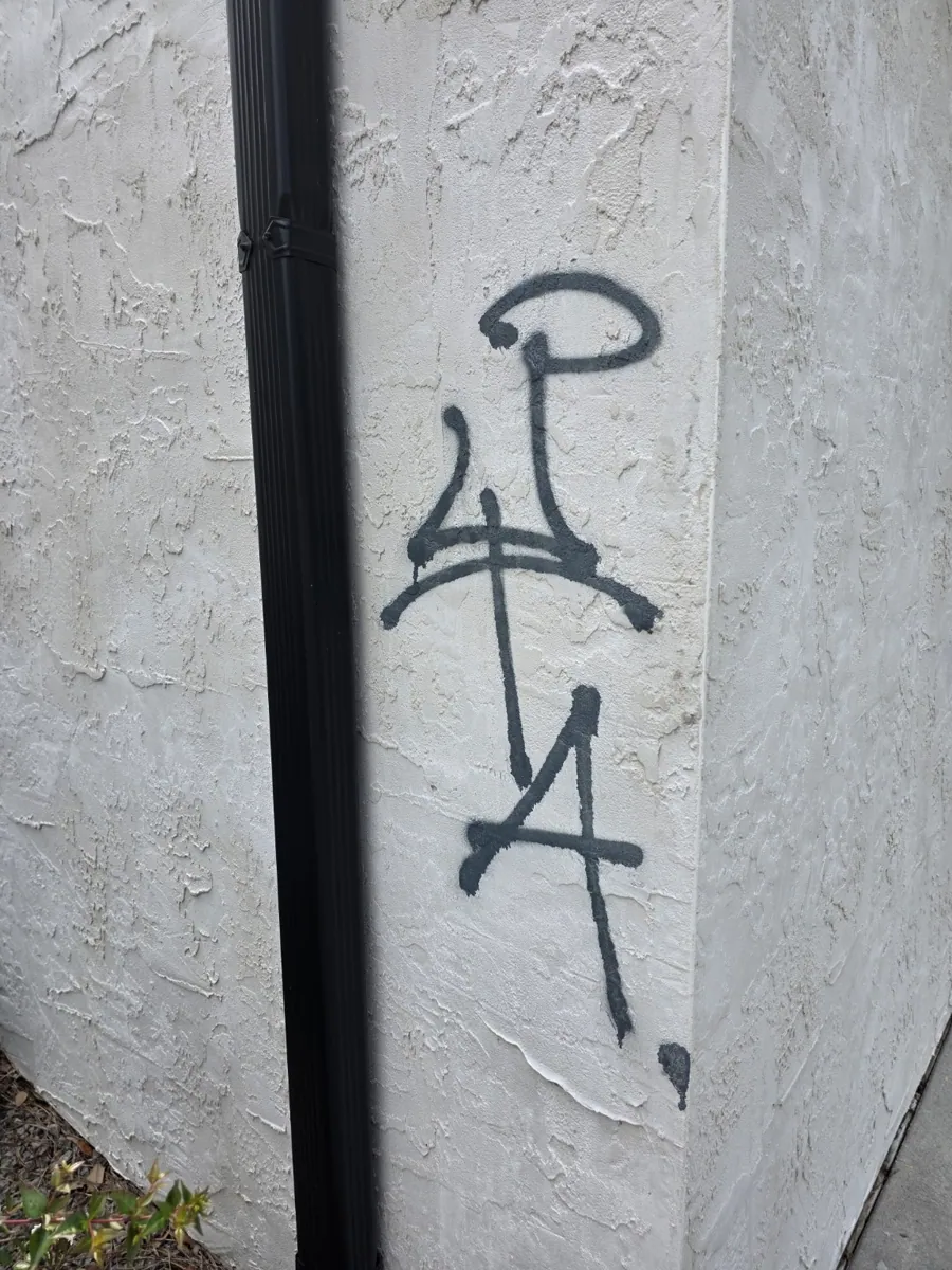 Graffiti on stucco before cleaning